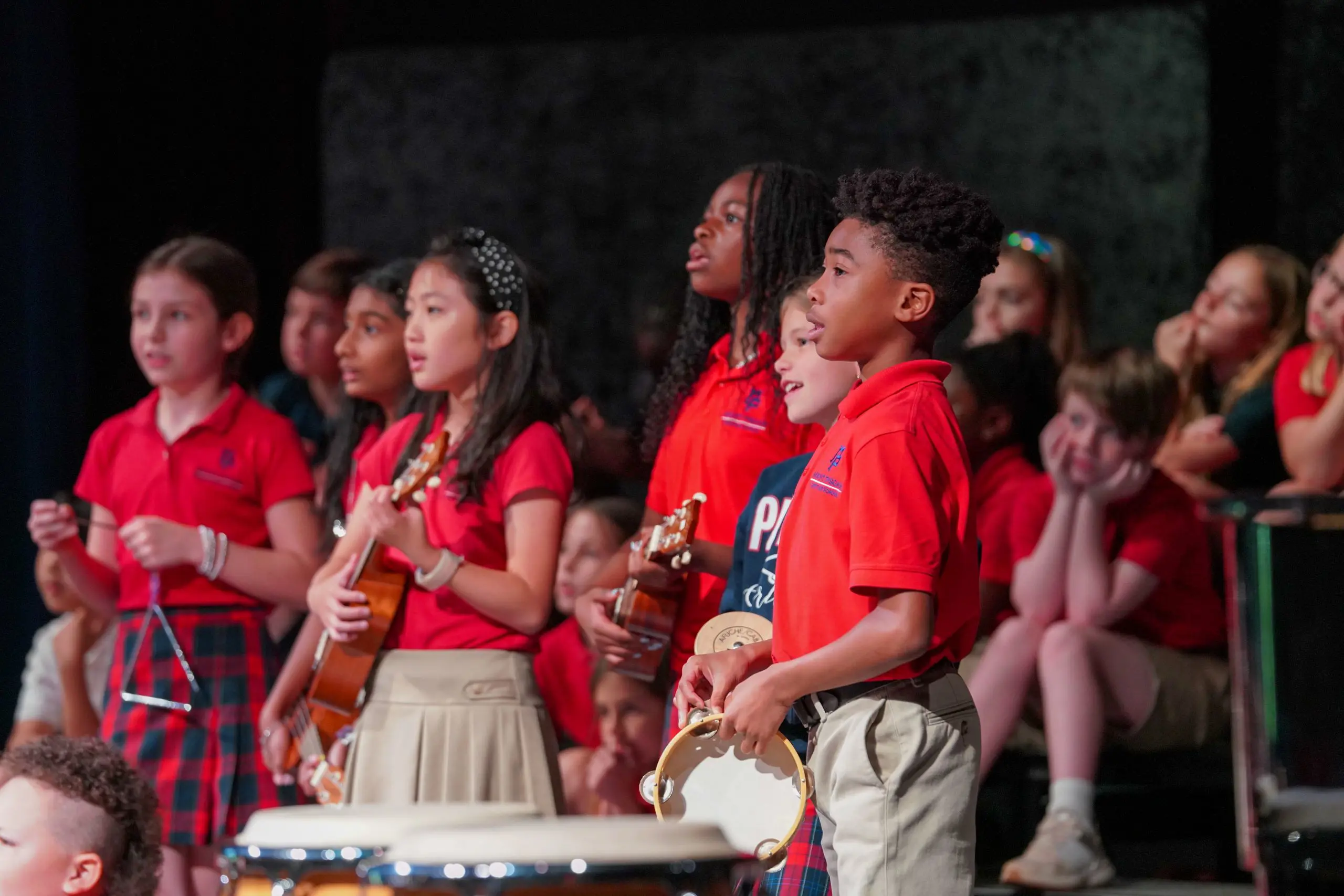 Students playing instruments onstage