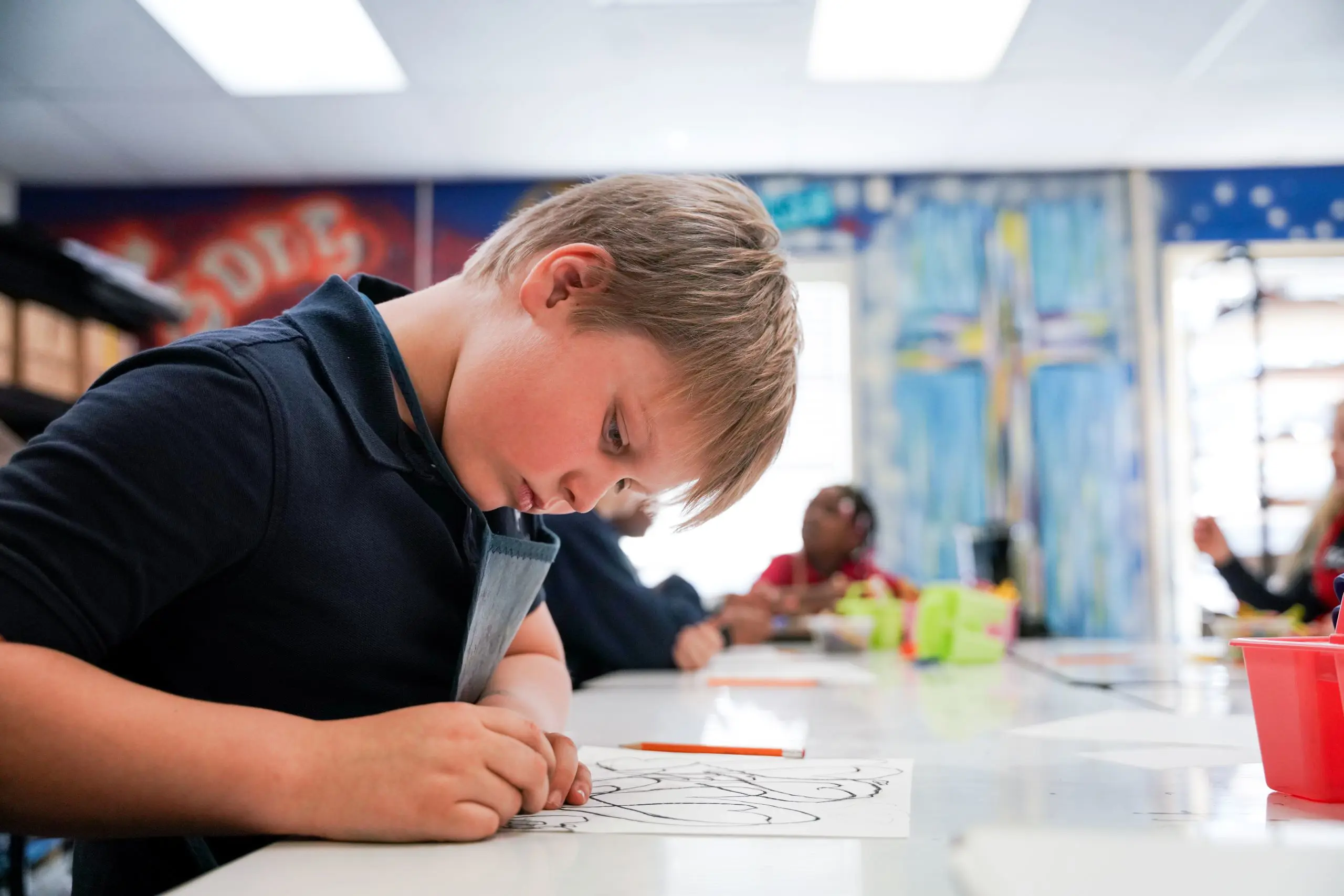 Young student drawing by hand