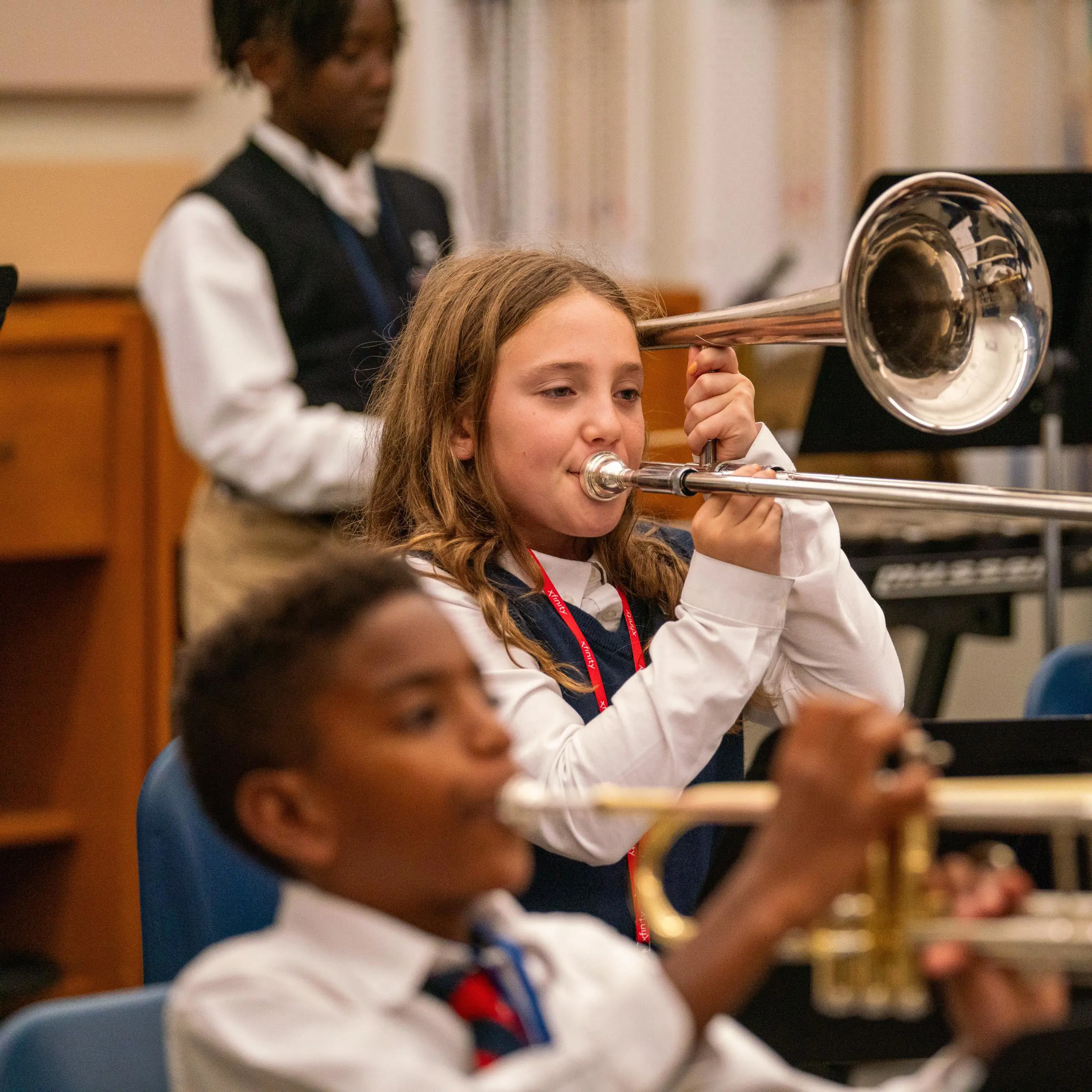 Students playing brass instruments