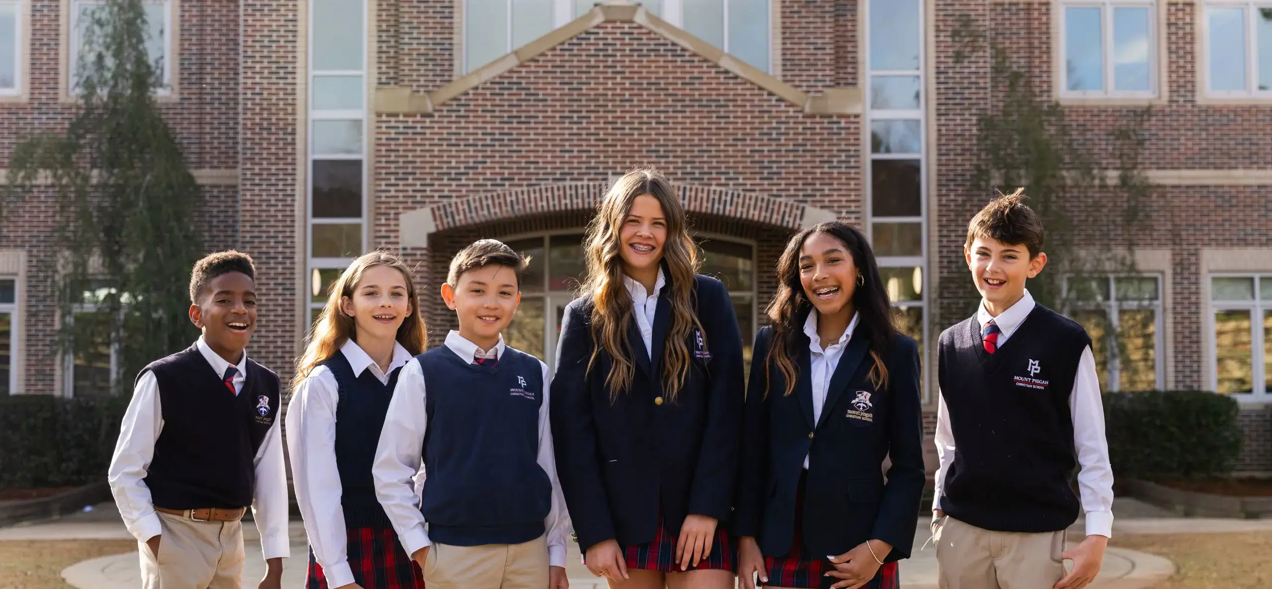 Students standing outside school building