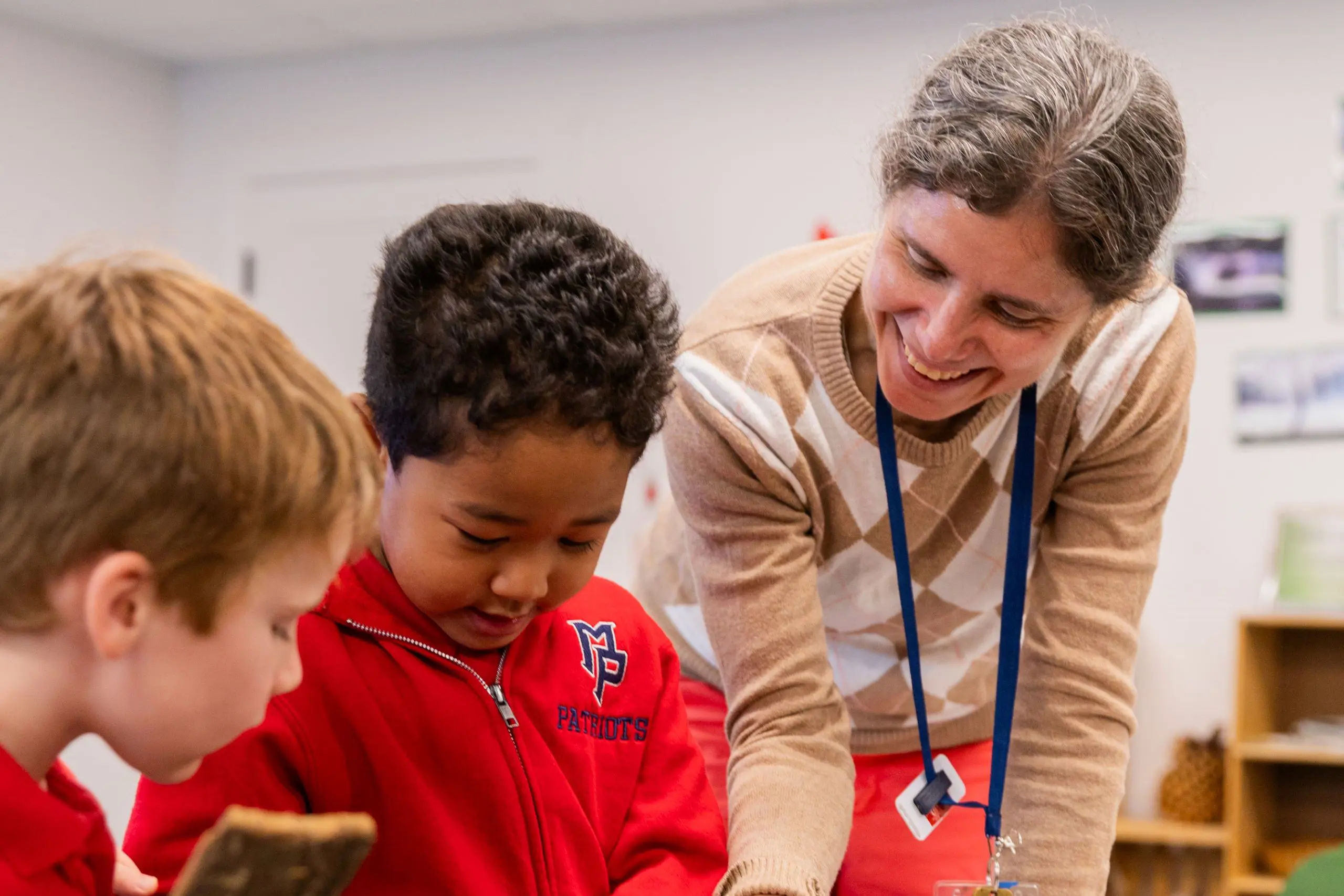 Teacher showing a demonstration to children