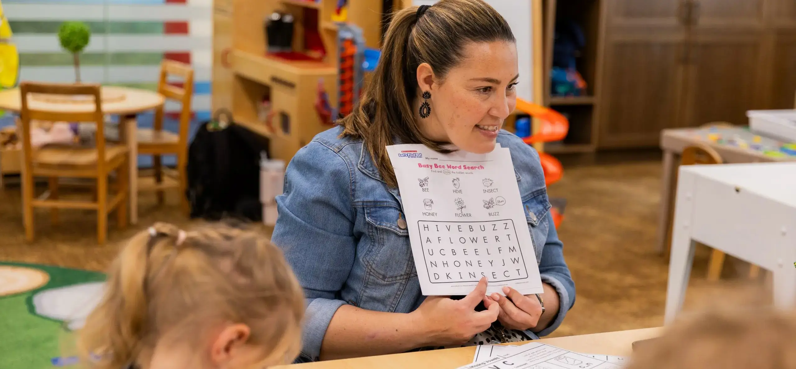 Teacher showing a demonstration to children