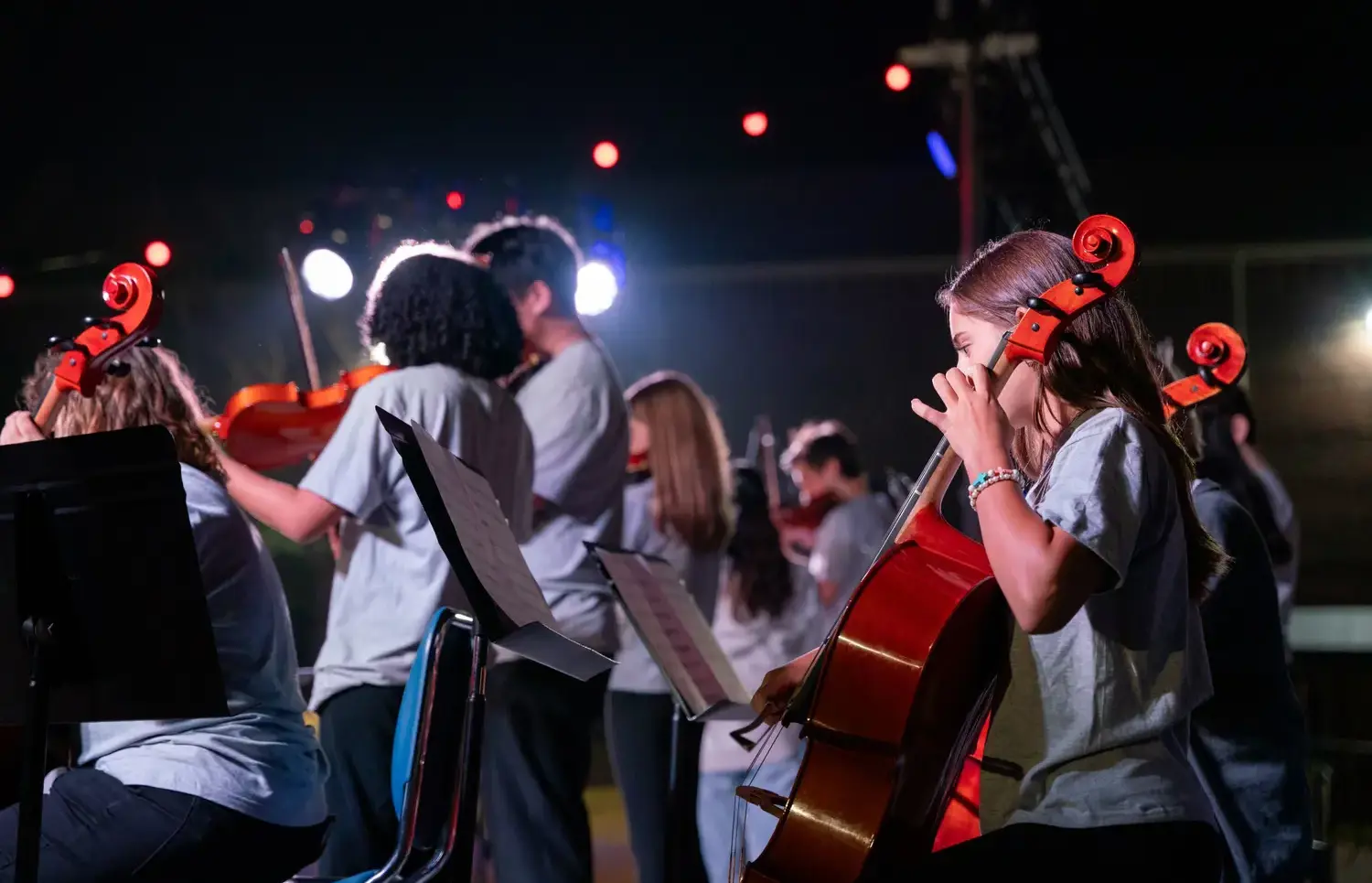 Students playing instruments onstage